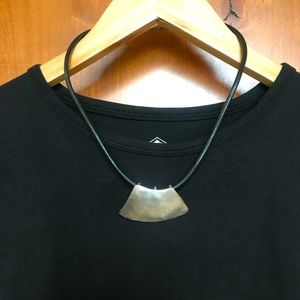 Silver and black cord necklace.